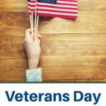 Veterans day free and discounted offers for food and services/ Pcitured hand holding American flag