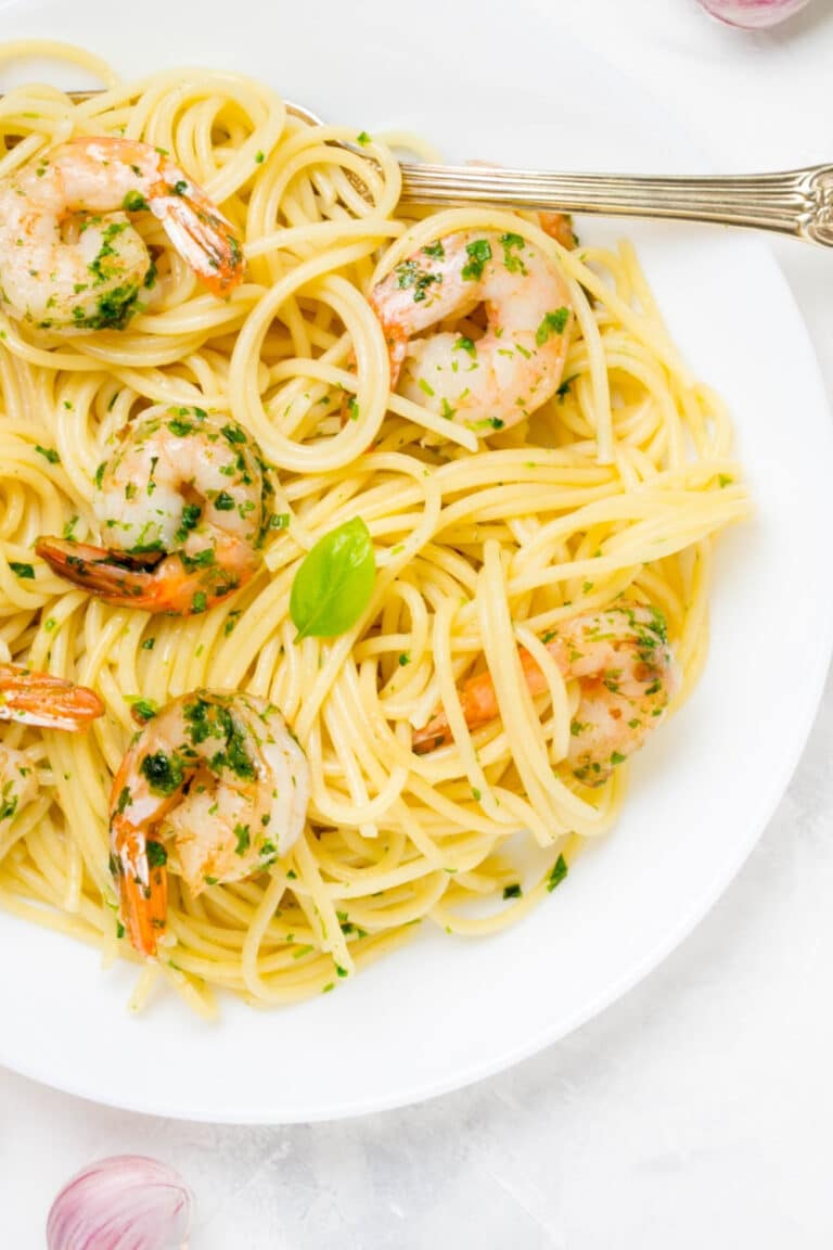 Shrimp scampi on white plate