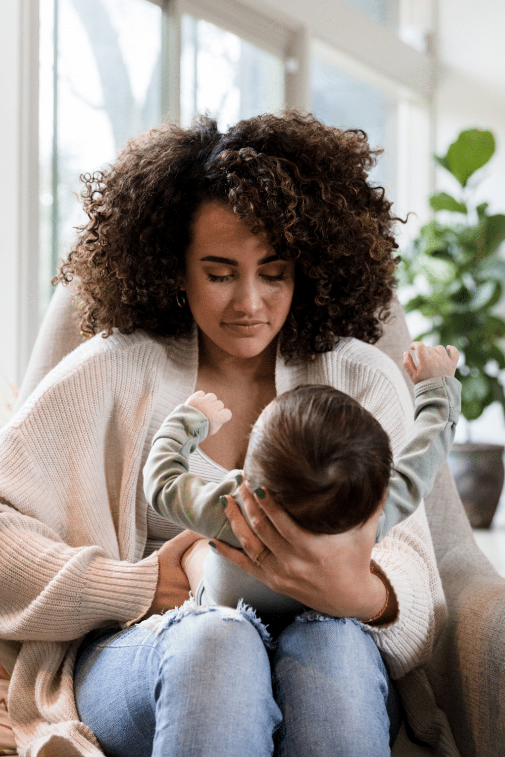 Woman holding baby stay at home parent