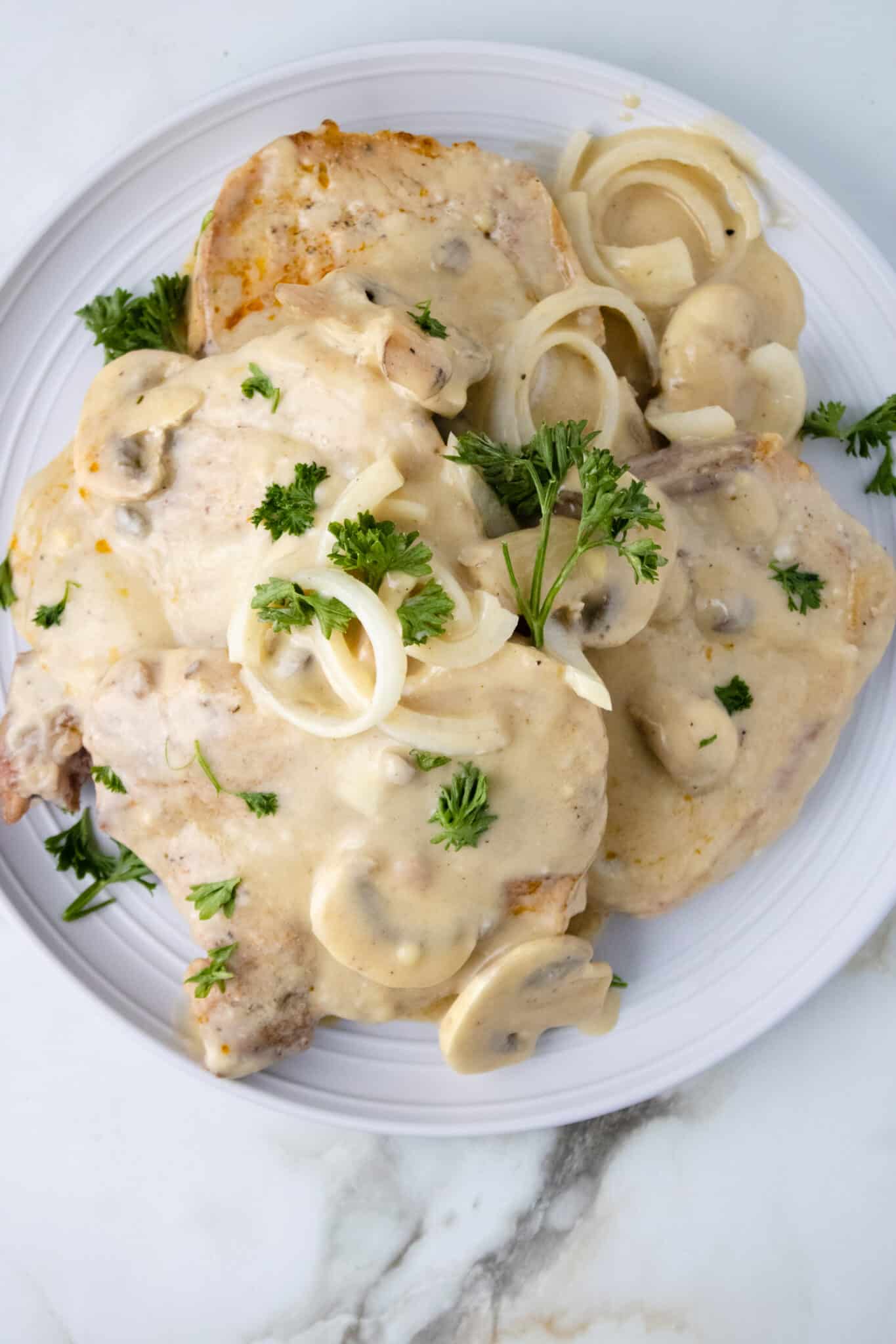 Smoothed Pork Chops on plate with mushrooms and cream gravy