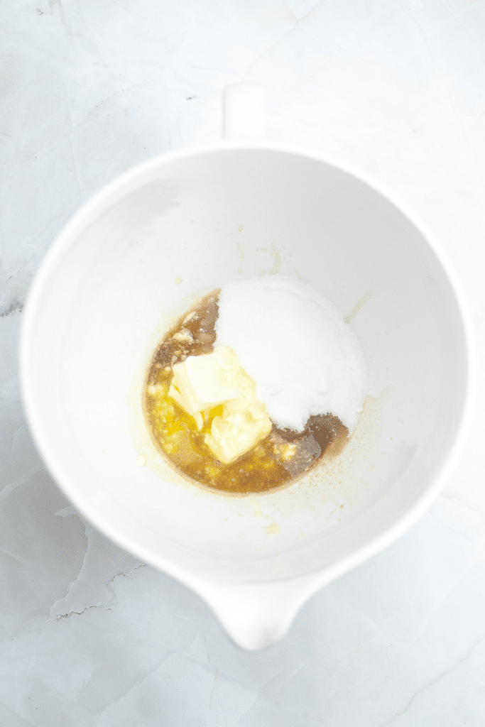 Creaming butter, sugar and vanilla together in mixing bowl