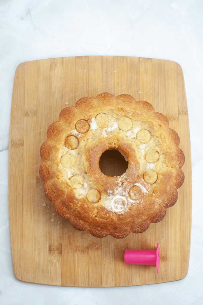 Cutting holes in bundt cake with cupcake hole maker